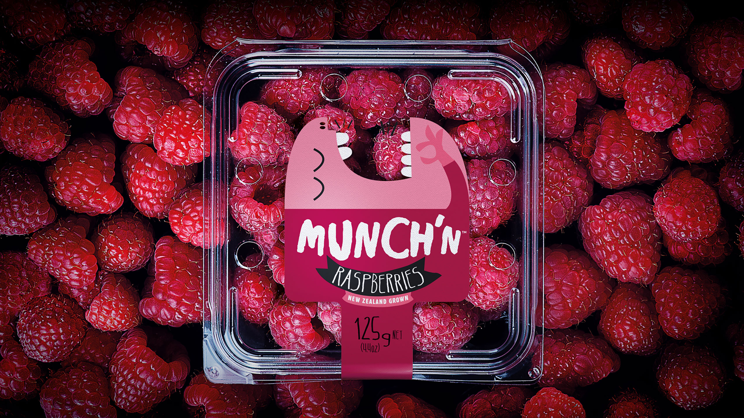 Packaging of Munch'n Raspberries on red raspberry background